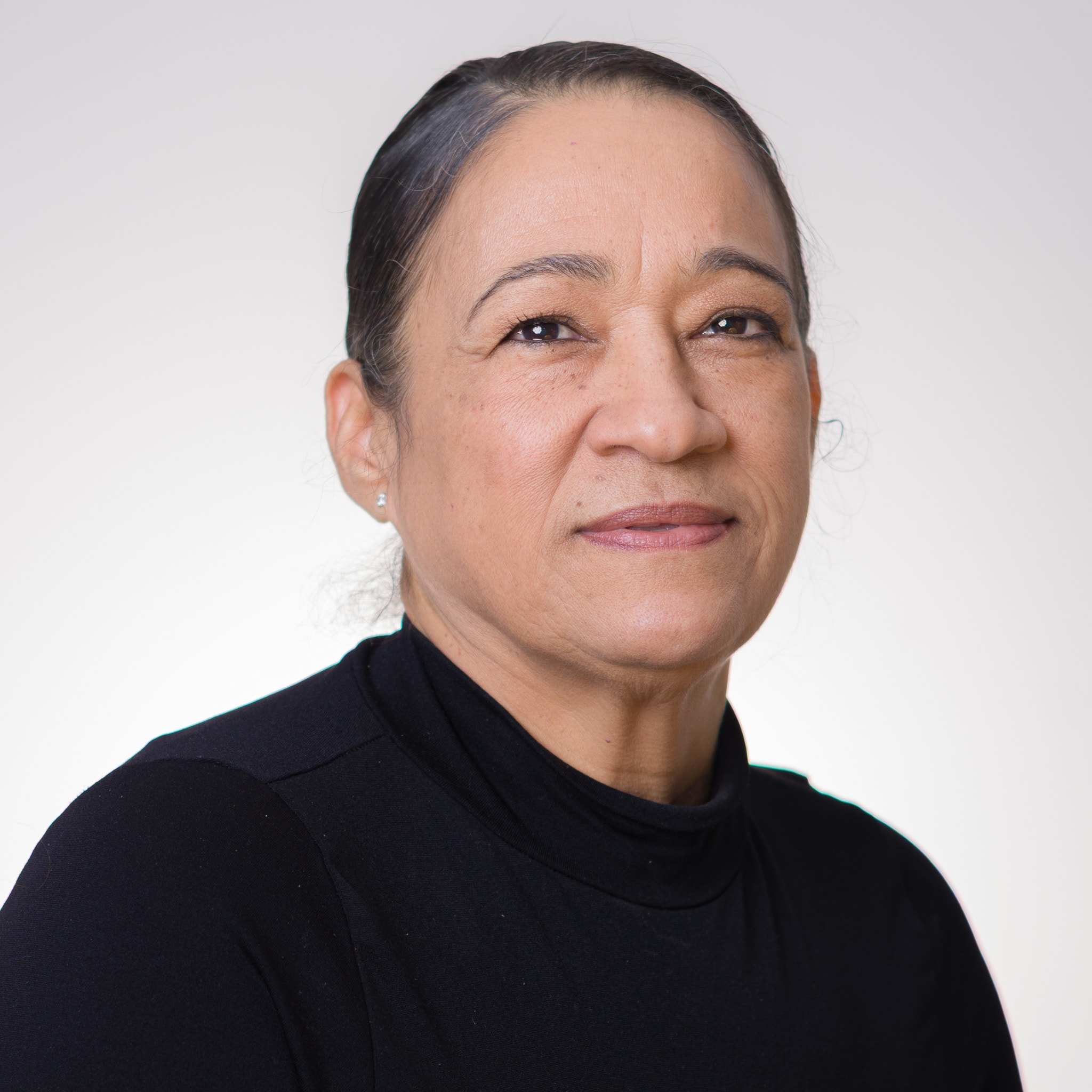 Corporate headshot portrait of a female professional on a light background, captured by Fuentes Studio in New York. LinkedIn — Fuentes Studio NYC