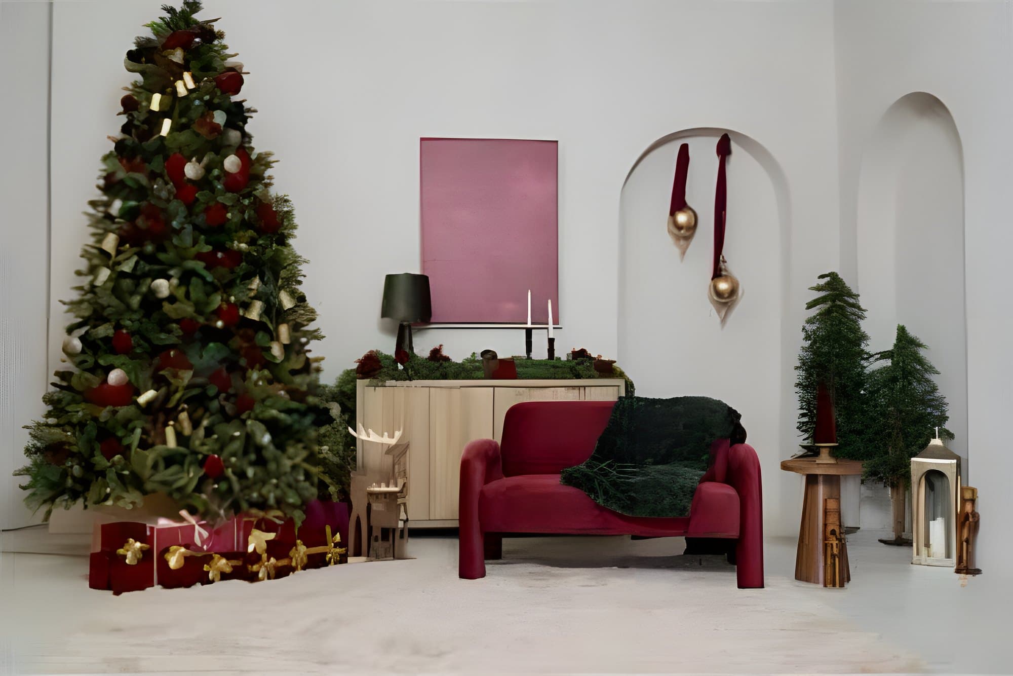 The Christmas studio set in Yonkers: a decorated tree with red and gold gifts, a burgundy velvet loveseat with a green throw, arched alcoves with gold ornaments, candles and a white rug