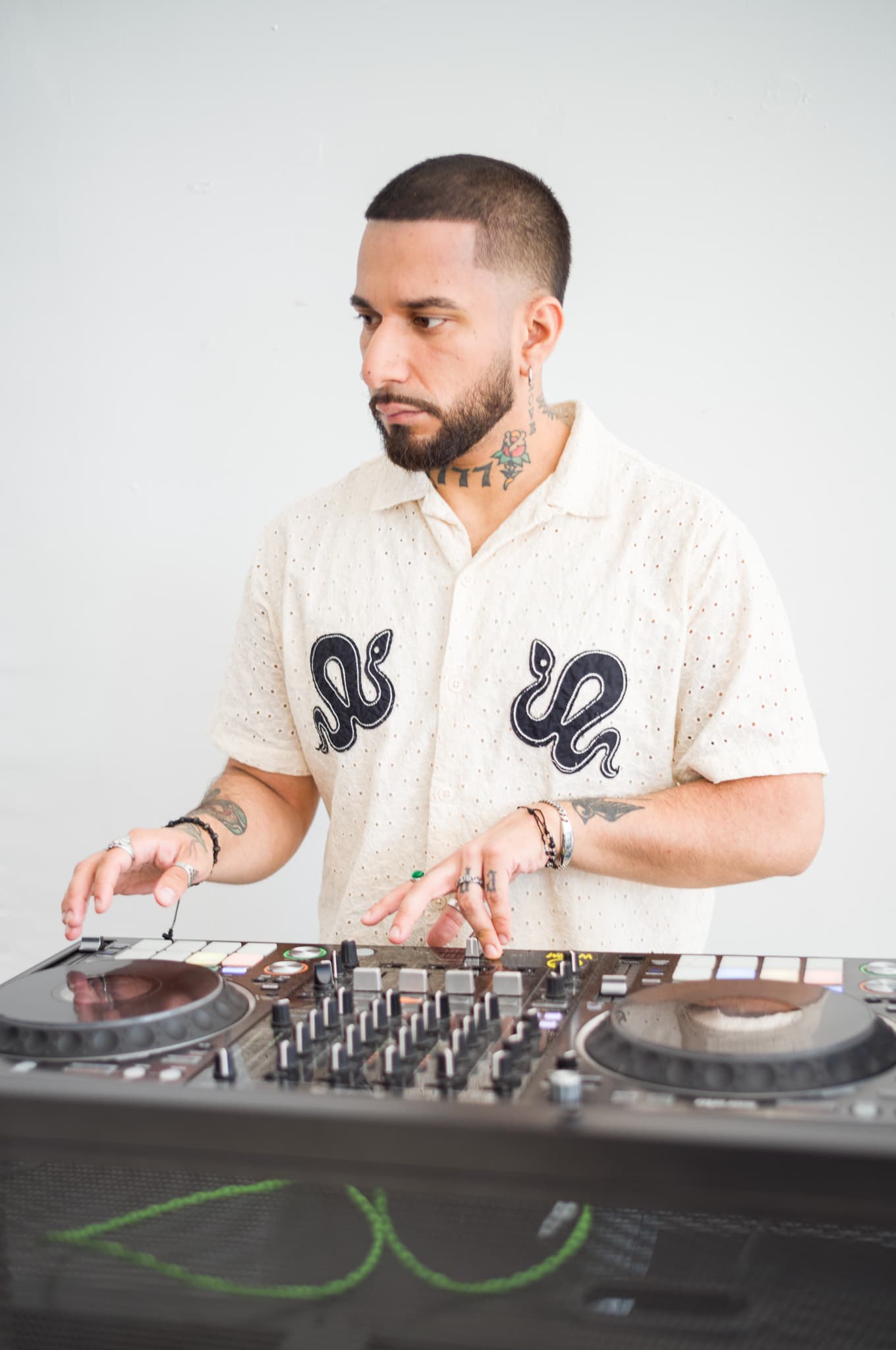 The DJ mixing tracks at the decks