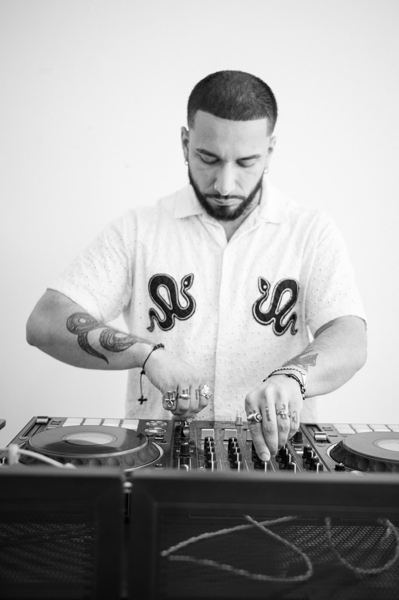 The DJ in black and white — focused and in the zone