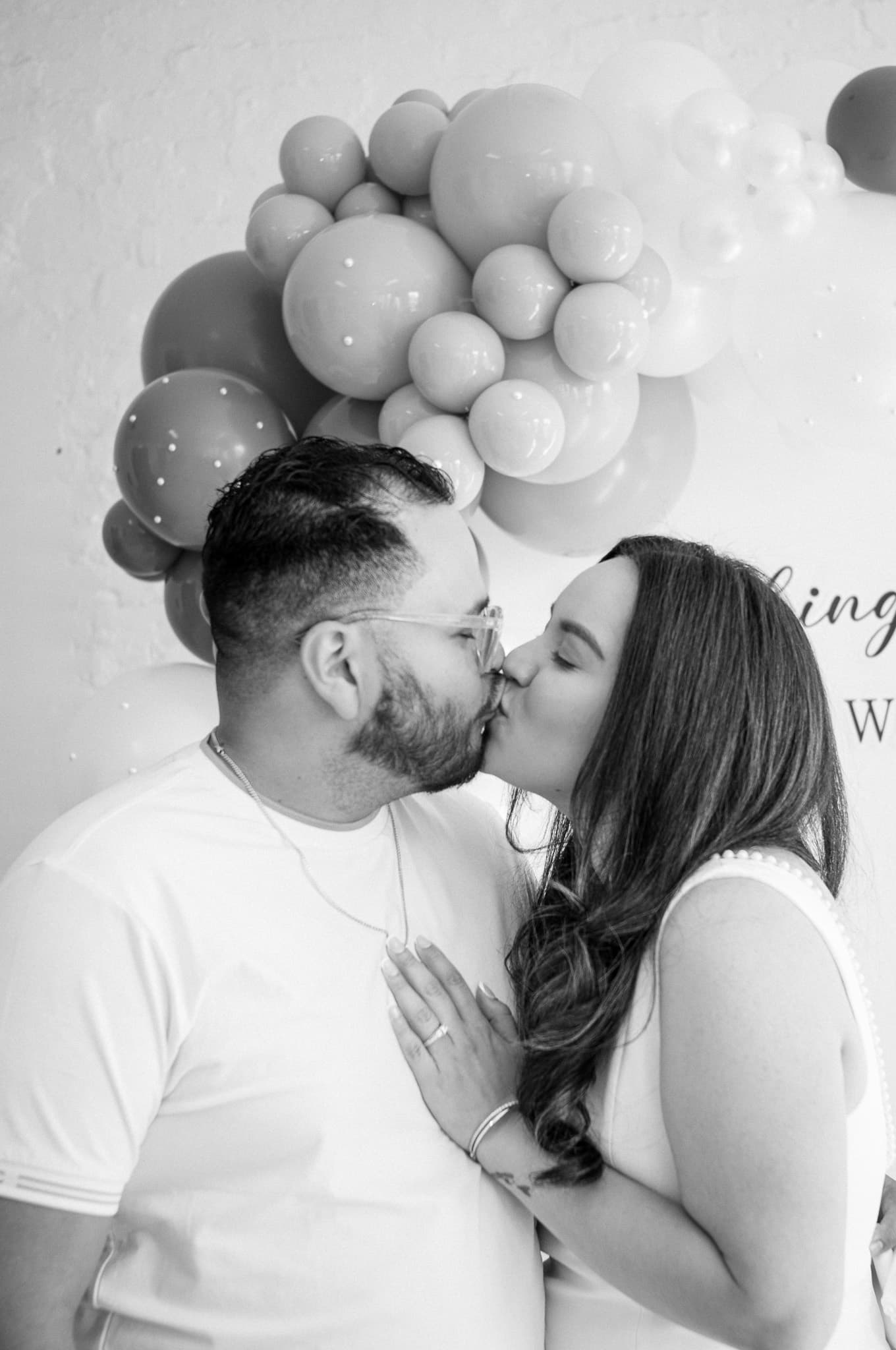 An intimate black-and-white moment between Jinet and John on the dance floor