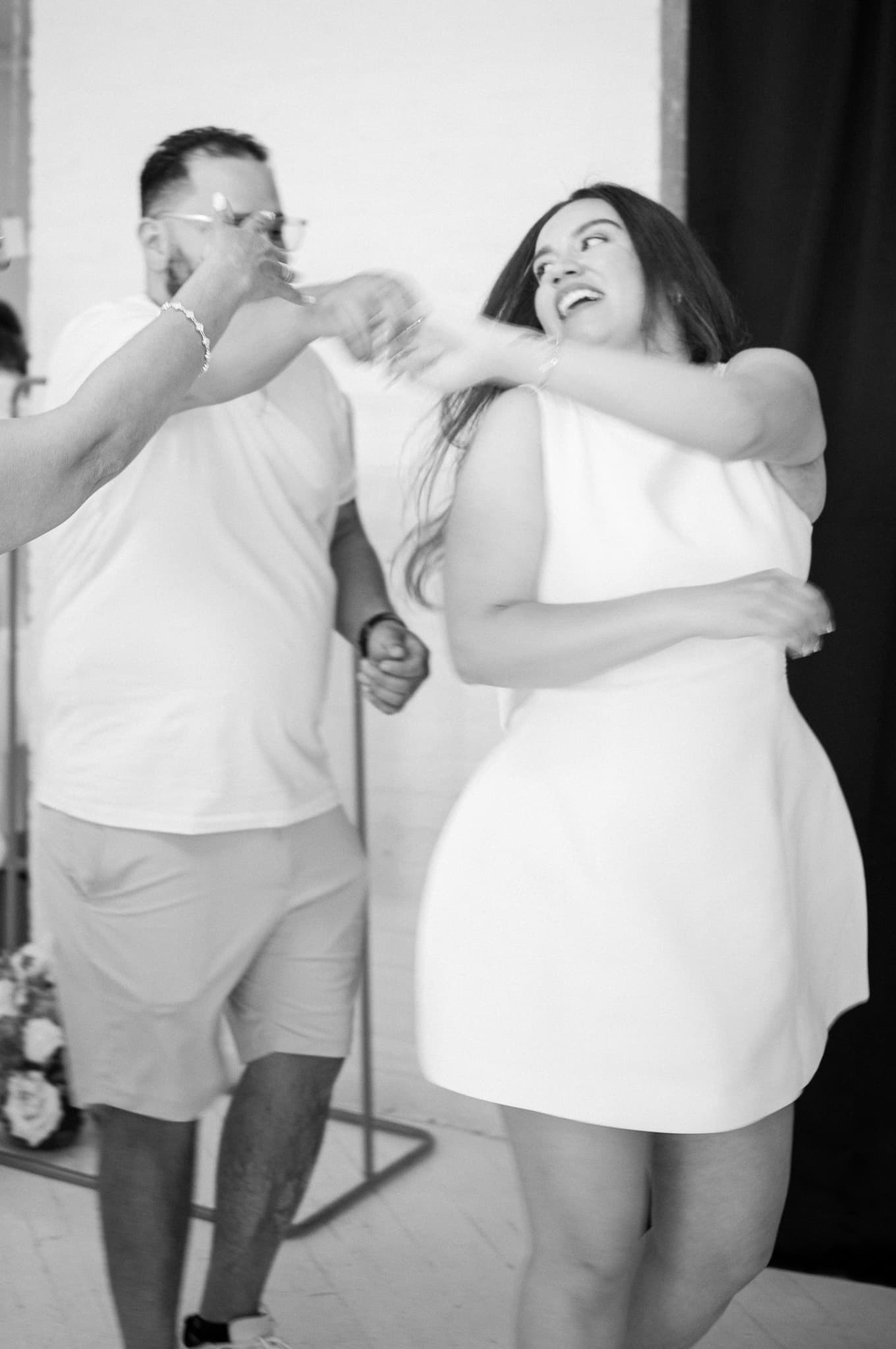 Jinet dancing and laughing — pure joy captured in black and white